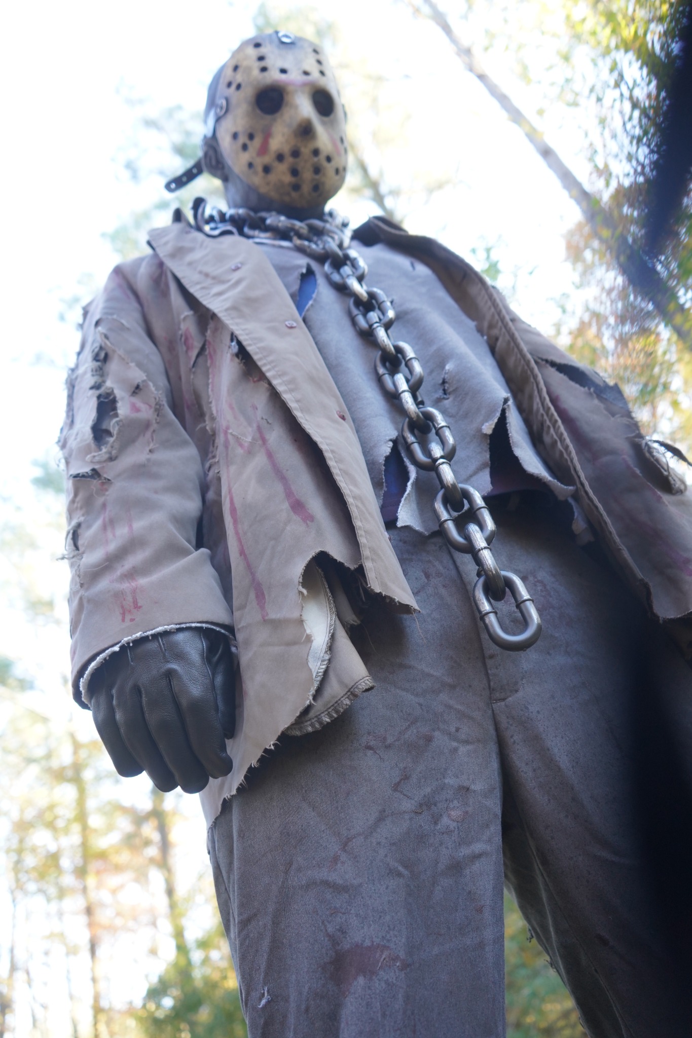 Low-angle view of the masked scare actor's costume